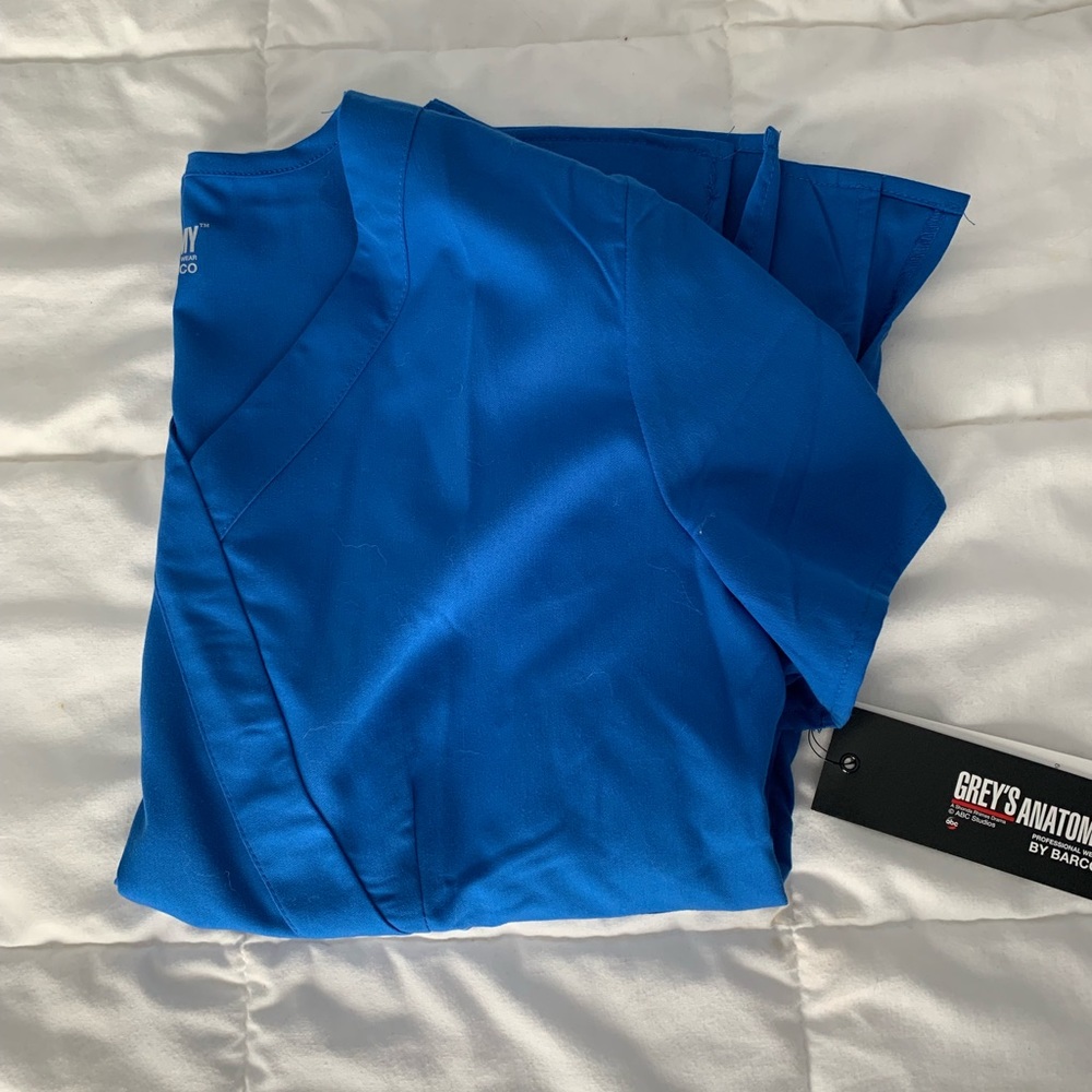 Never been worn Royal Blue scrub top size L.